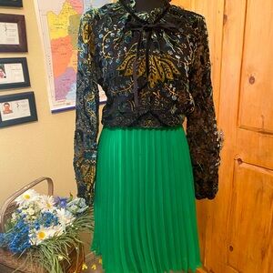 Green , pleated skirt , knee length
